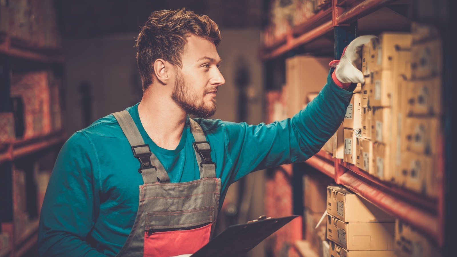 Worker on a automotive spare parts warehouse